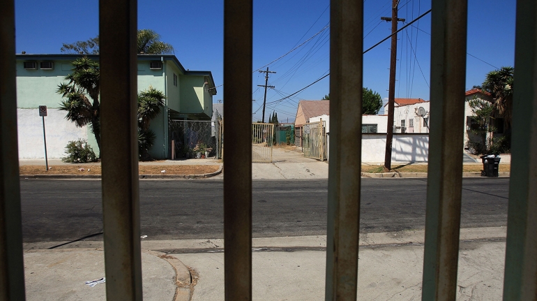 LOS ANGELES, CA - SEPTEMBER 04:  Gates protect some allies that run along Western Avenue, an area where an elusive serial killer has been dumping bodies since 1985, on September 4, 2008 in the South Los Angeles neighborhoods of Los Angeles, California. Using DNA and ballistics analysis, police have linked a lone killer to at least 11 murder victims whose bodies were dumped near Western Avenue, mostly in alleys, over the past 23 years. Detectives are also investigating nearly three dozen addition cases with similarities to these slayings. With the exception of one male victim, the Grim Sleeper, as some reporters are calling the suspect, targets young black women whom he shoots and rapes. One woman, known as Victim Number 9, survived after the suspect shot then raped her before relenting to her plea to let her fall out of his car. Bullets removed from her chest matched a gun used on eight prior victims. $500,000 is being offered for information leading to his arrest and conviction.  (Photo by David McNew/Getty Images)